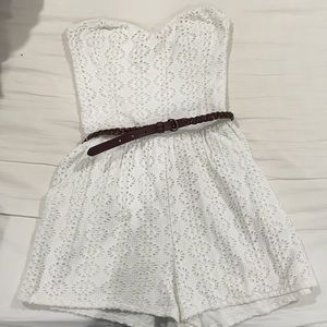 White romper with brown braided belt